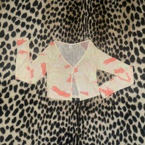 Sheer long sleeved top.